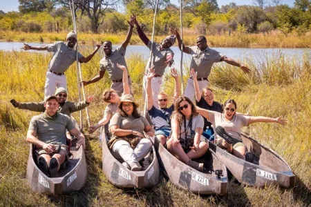 a group of people in canoes