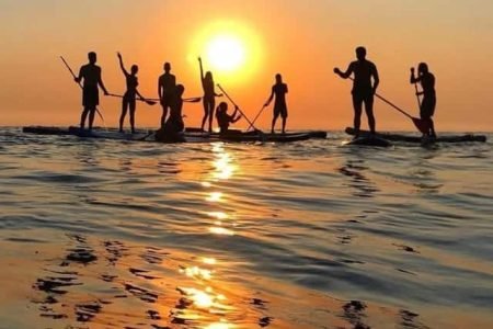 a group of people on a beach