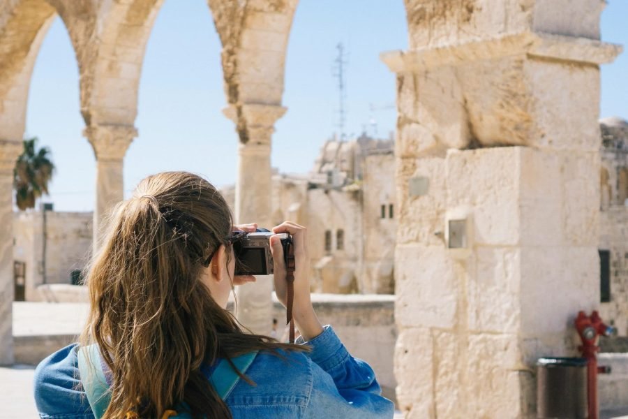 Woman Taking Pictures of Ruins in Jerusalem, Israel