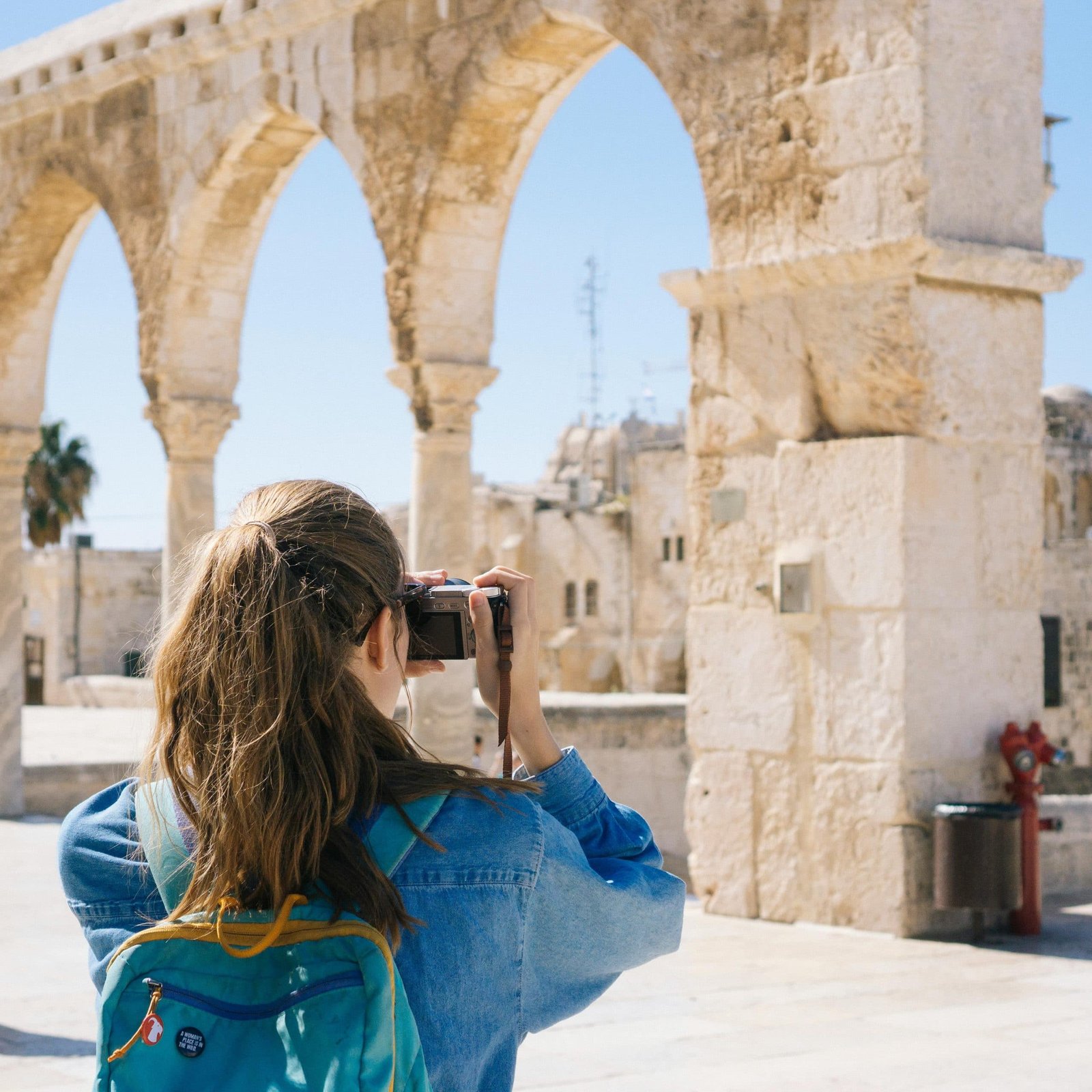 Woman Taking Pictures of Ruins in Jerusalem, Israel