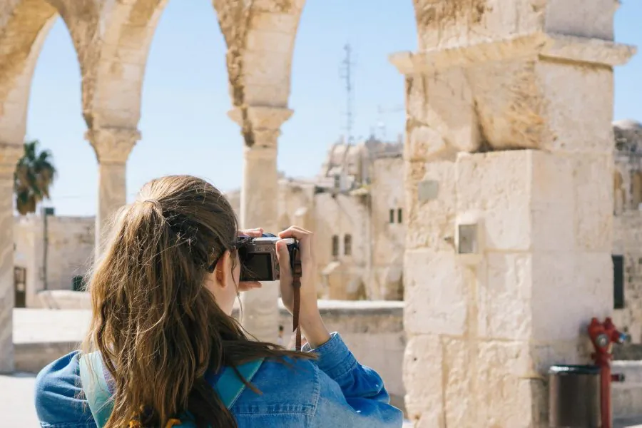 Woman Taking Pictures of Ruins in Jerusalem, Israel